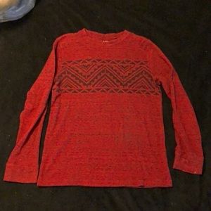 Medium maroon long sleeve shirt with black design on front